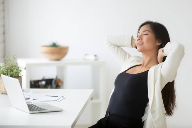 Hands resting on lap during seated breathing