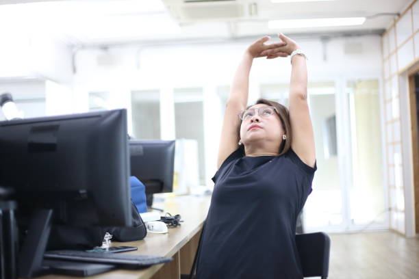 Side view of gentle neck stretch at workstation